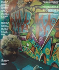 the cover of a magazine with graffiti on it